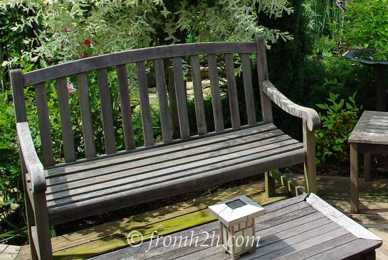 An old wood bench on a deck