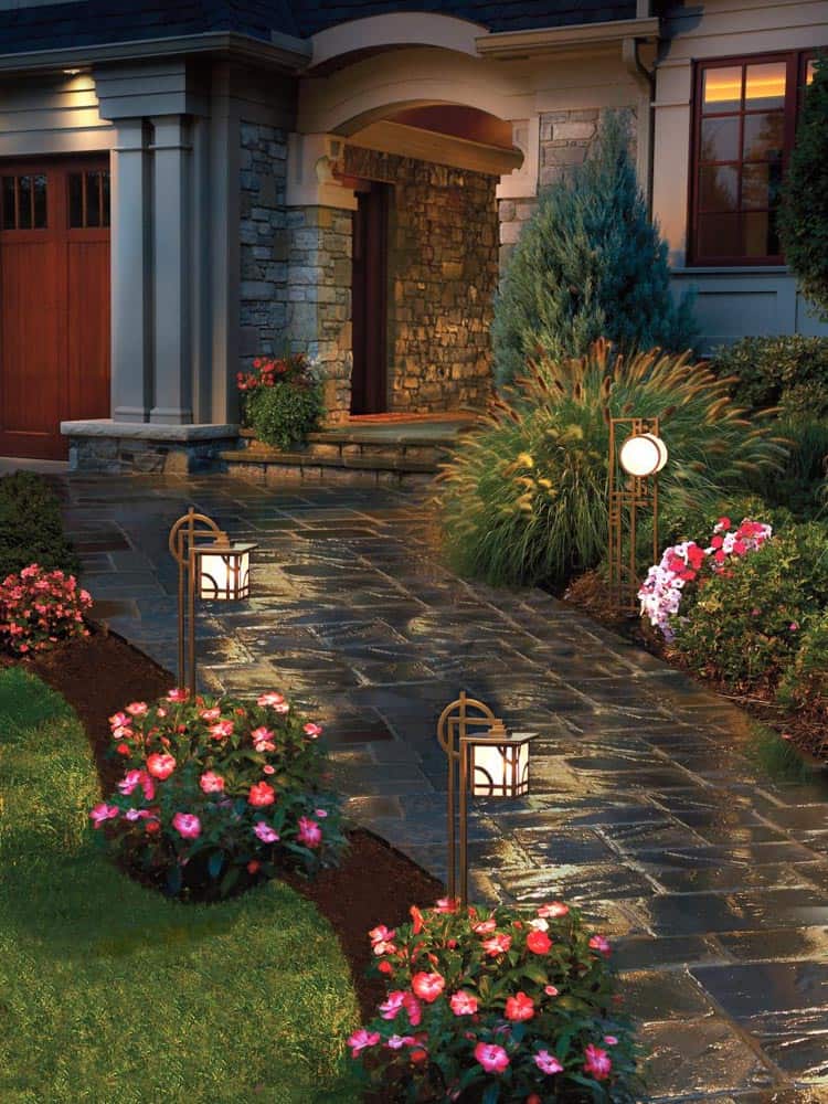 Low voltage landscape lights can make a house look magical at night, via diynetwork.com | 10 Beautiful Ways To Light Your Garden