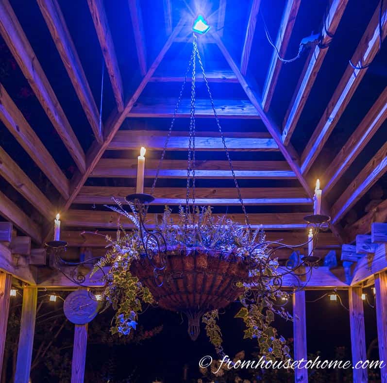 Using an LED flood light lets you change the color with a remote | 10 Beautiful Ways To Light Your Garden