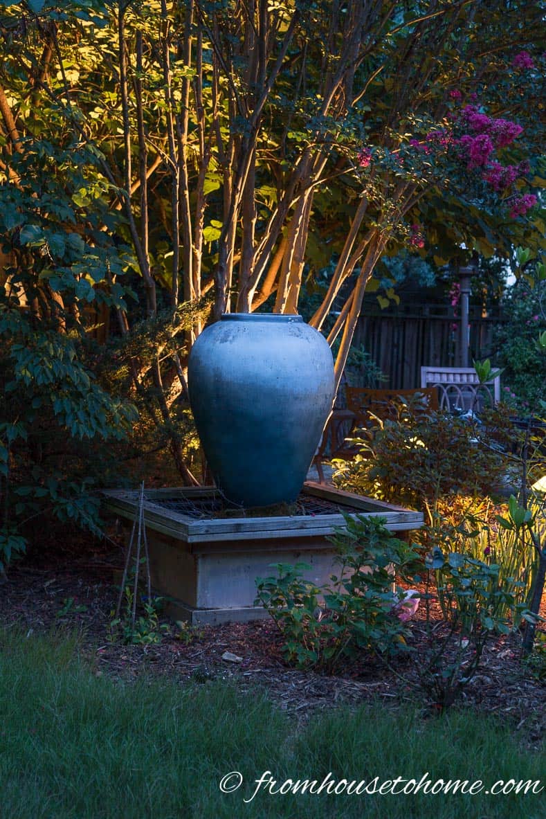 Uplighting behind an urn in the garden