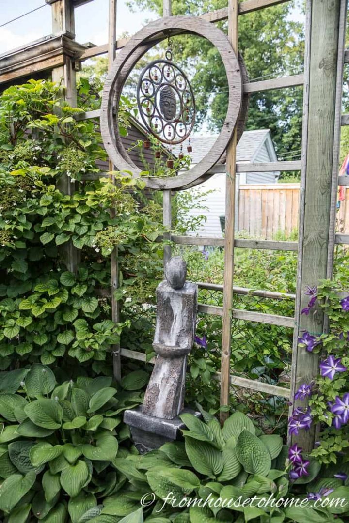 Wind chime above a statue in the garden