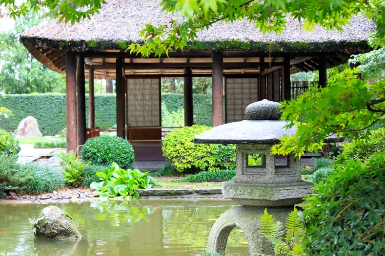 A stone lantern near the tea house in a Japanese Garden