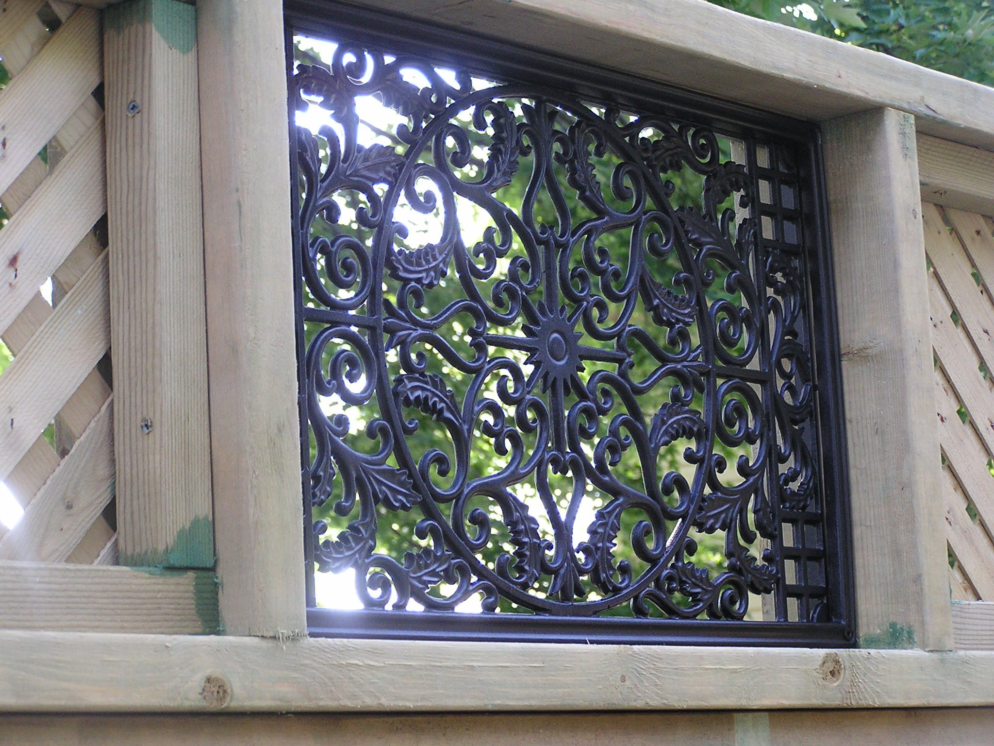 Metal iron design peephole in fence
