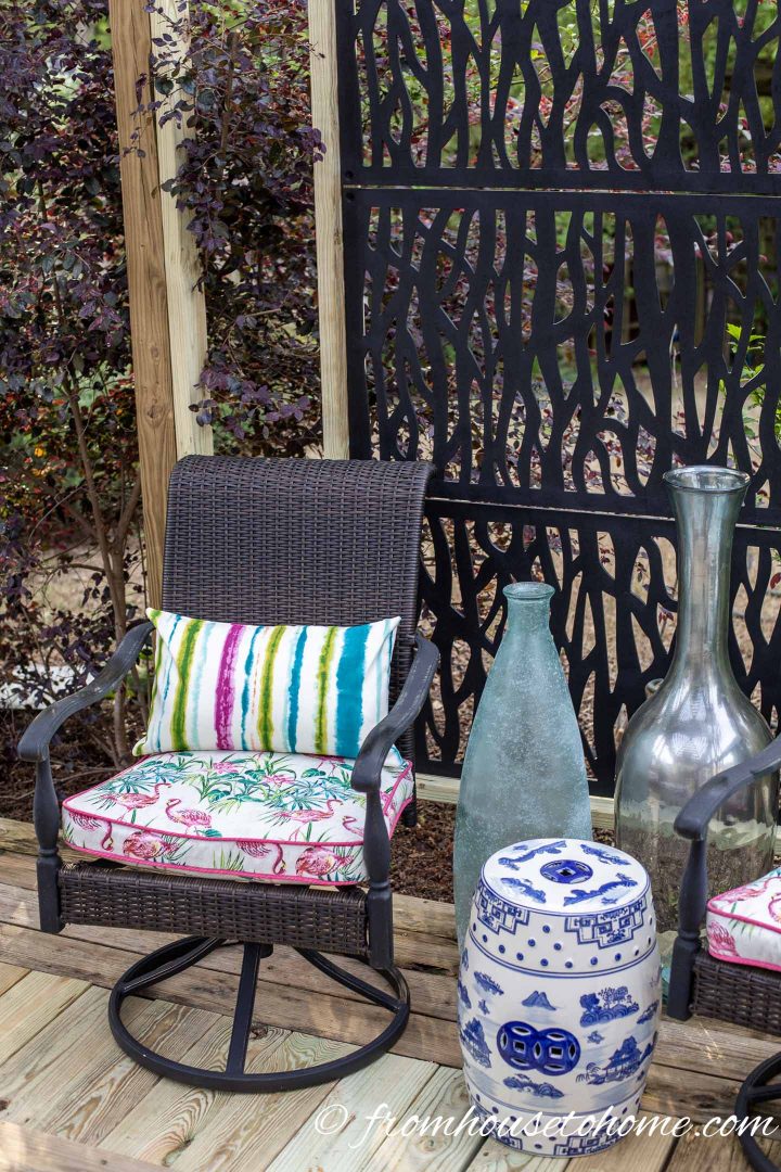 Deck chair in front of a DIY privacy screen made with black lattice