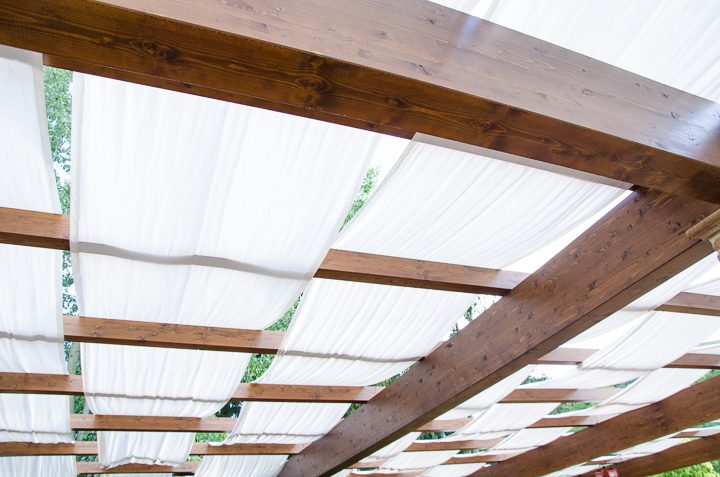 Overhead shade structure provides backyard privacy from a 2 story house next door ©DPI studio - stock.adobe.com