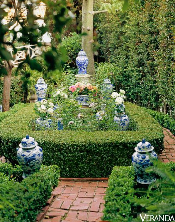 Blue and white ginger jars in the garden by Mary McDonald, via Veranda