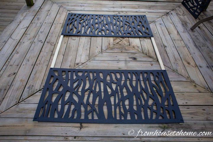 The second decorative panel installed on the wood slats