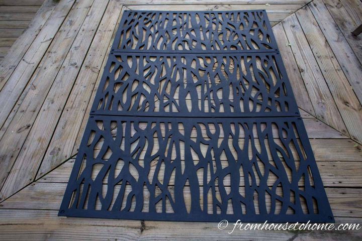 The third decorative panel installed on the wood slats