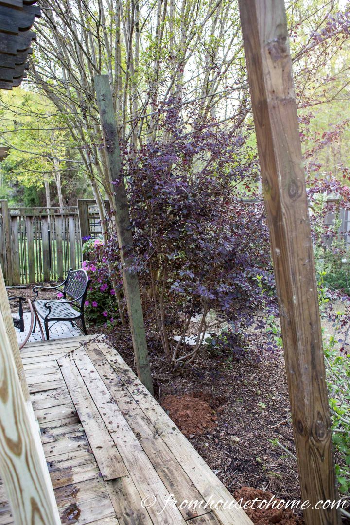 The DIY privacy screen posts in holes in the ground