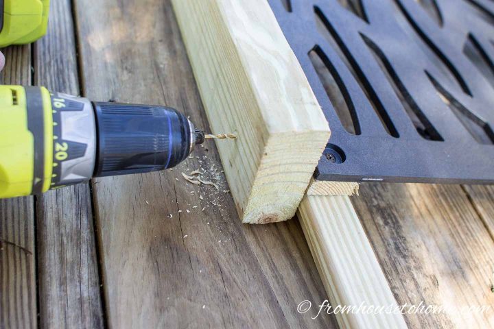 Holes being pre-drilled so that screws won't cause the privacy screen wood frame to split
