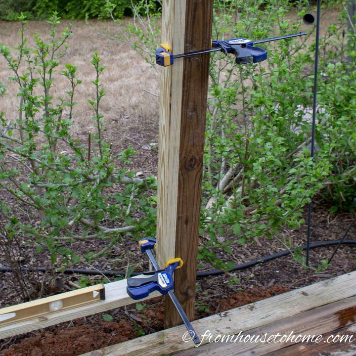 Clamps make sure the boards in the privacy screen frame line up with the posts correctly