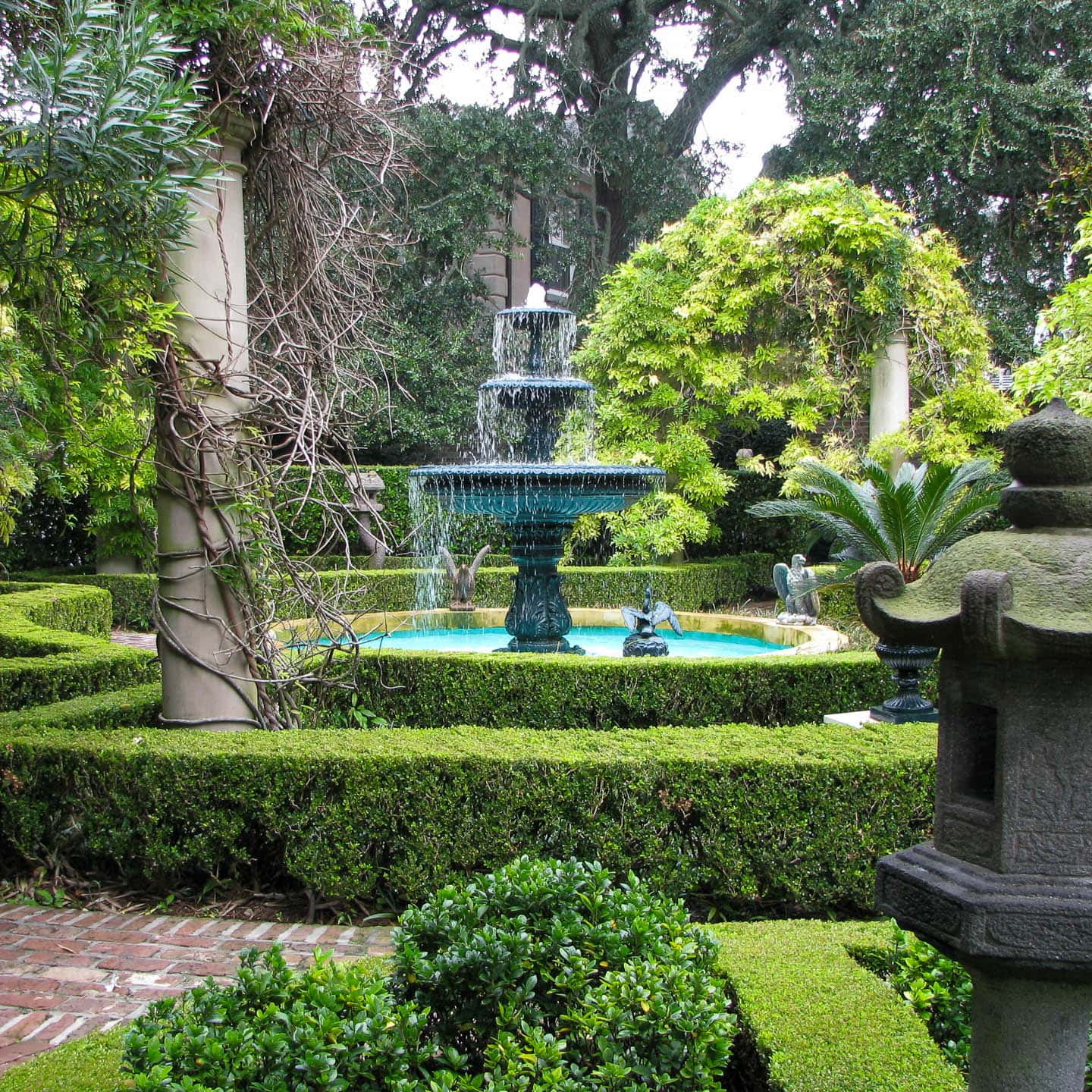 large water fountain in the middle of a Charleston garden