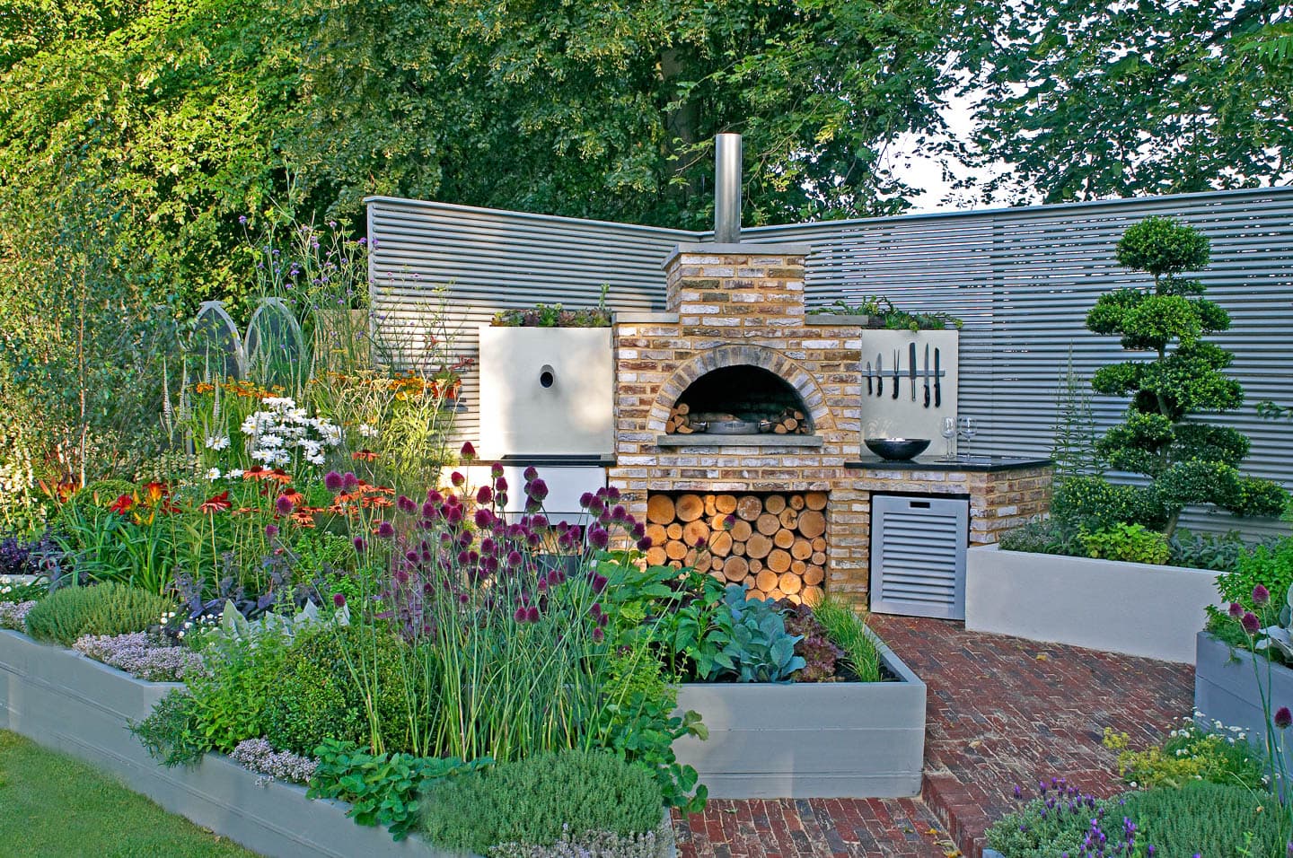raised beds filled with perennials around a patio