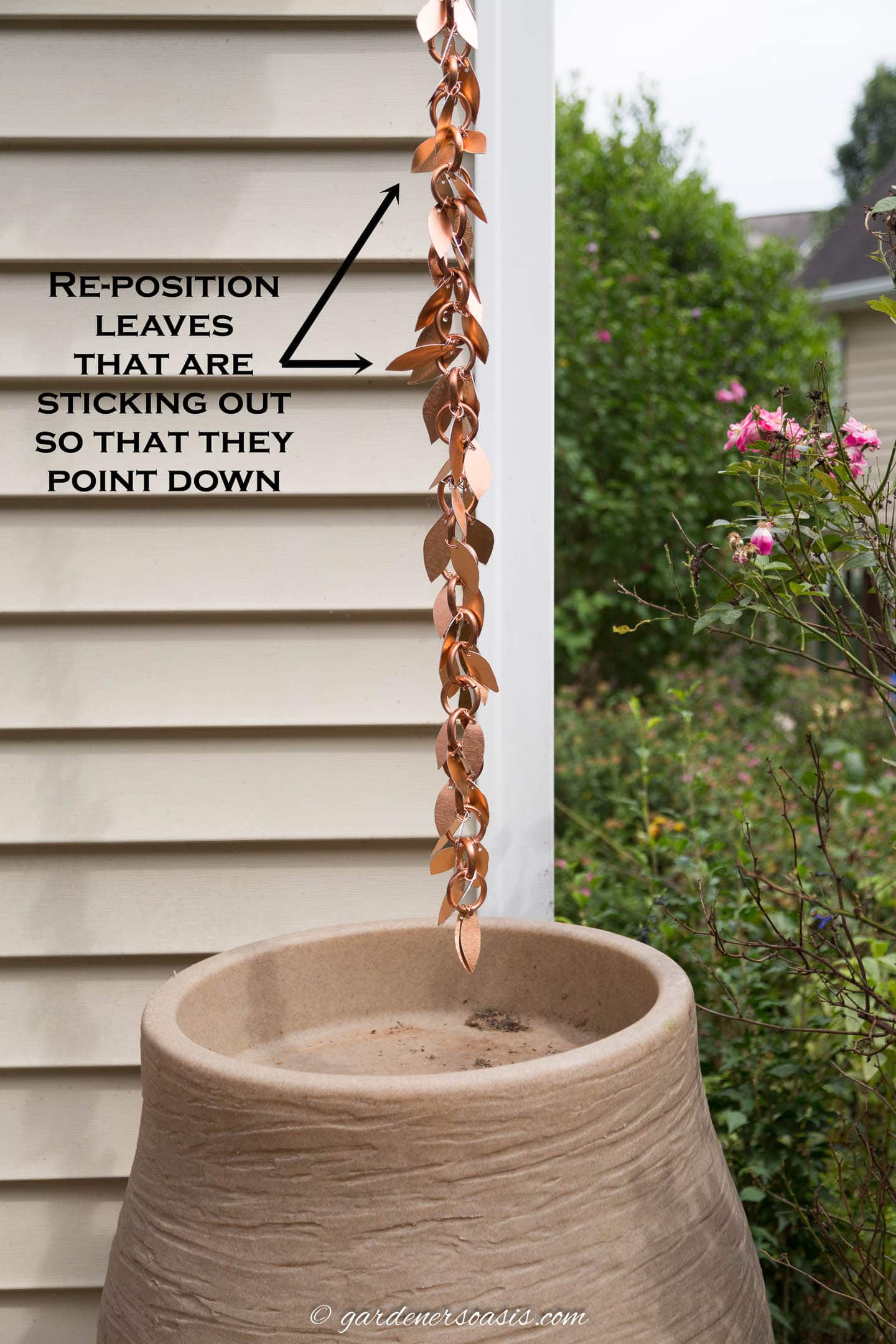 Re-position leaves on the rain chain that are sticking out
