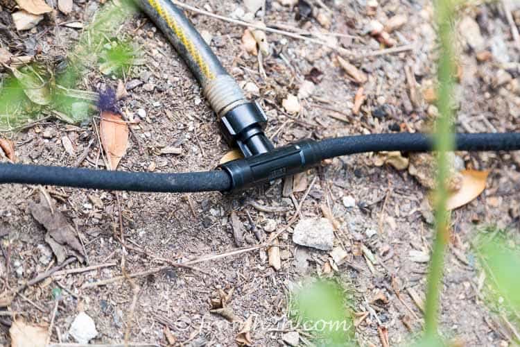 A soaker hose system splitter connection installed in a hose