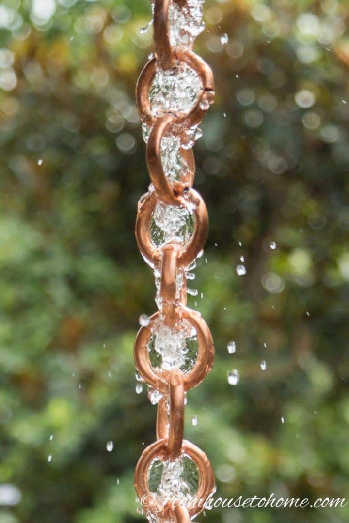 Rain chain with water running down it