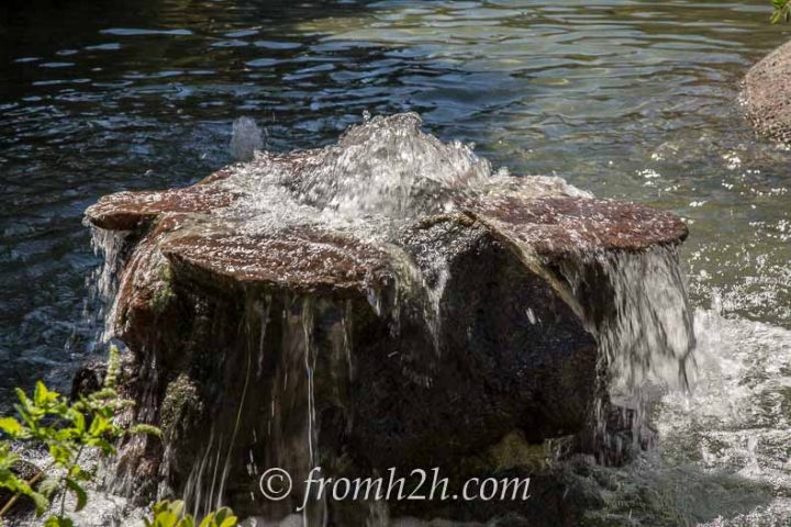 Create a bubbling fountain by drilling a hole in a rock