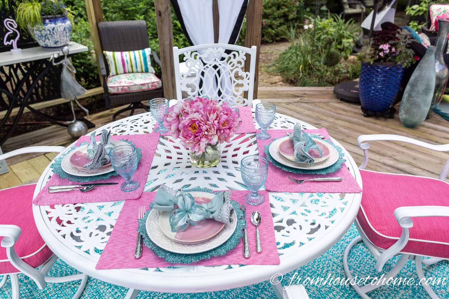 A round patio table on a small deck