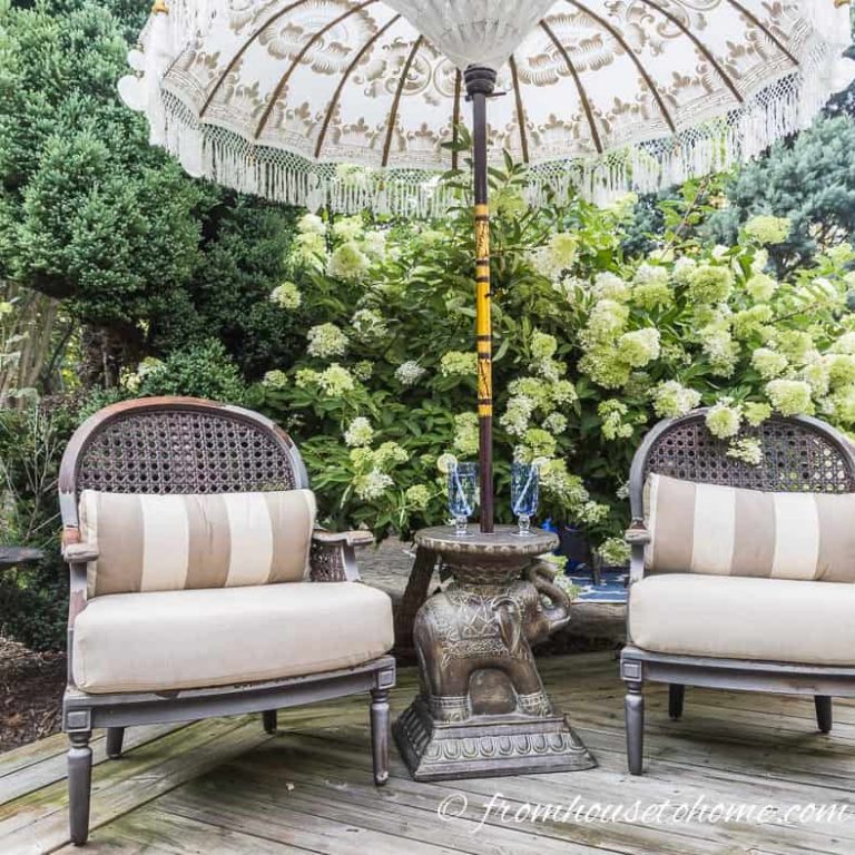 Two chairs and an umbrella on a small patio