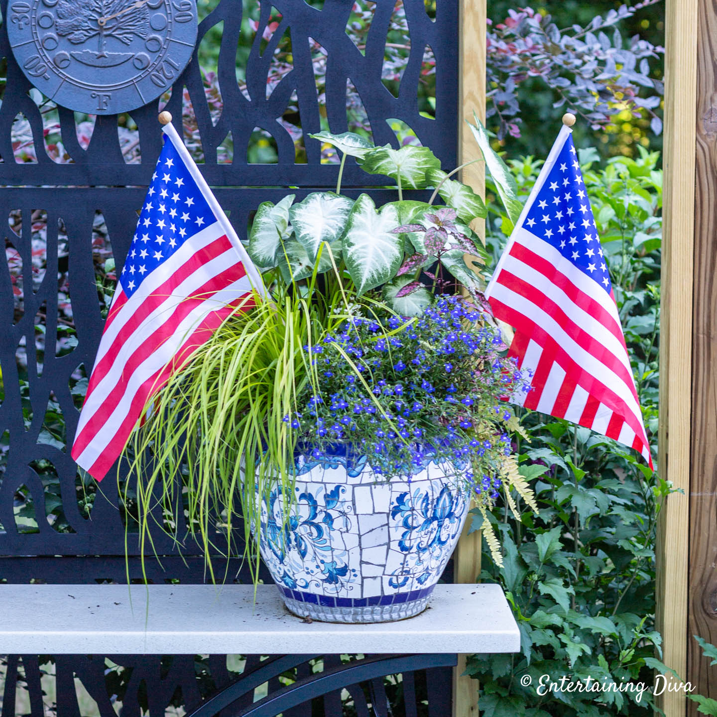 A patriotic planter with two American flags on the sides