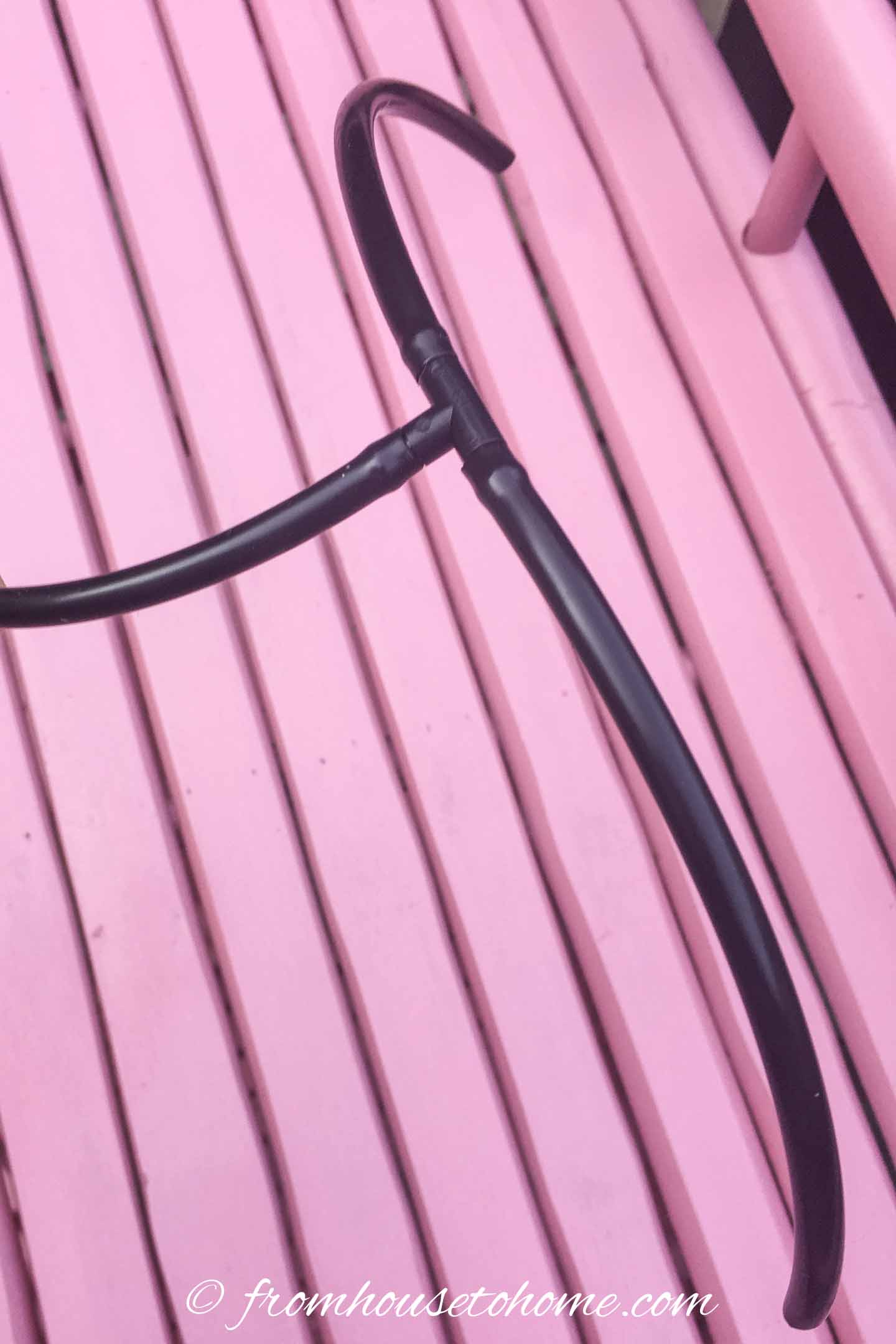 A tee connector installed at the end of a micro hose