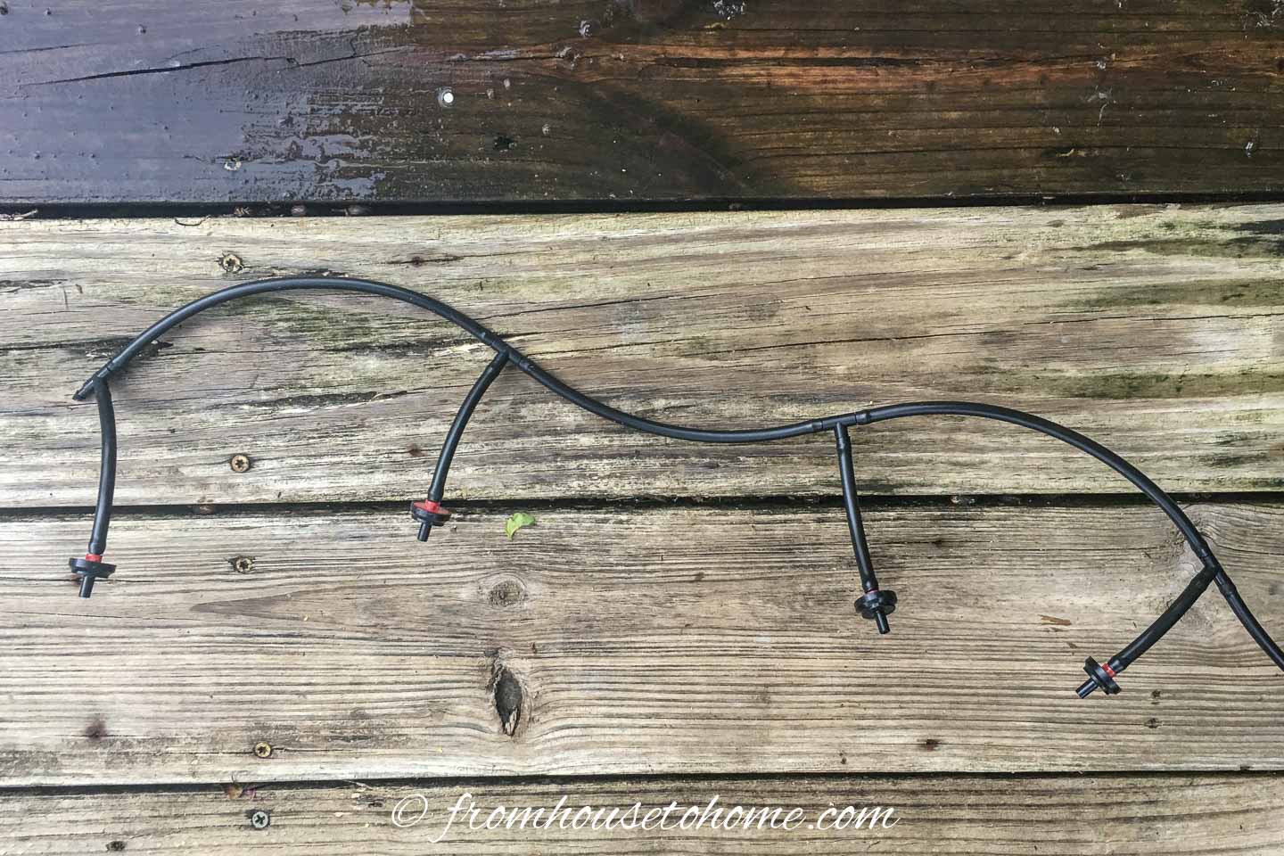 The container watering system hose configuration for window boxes