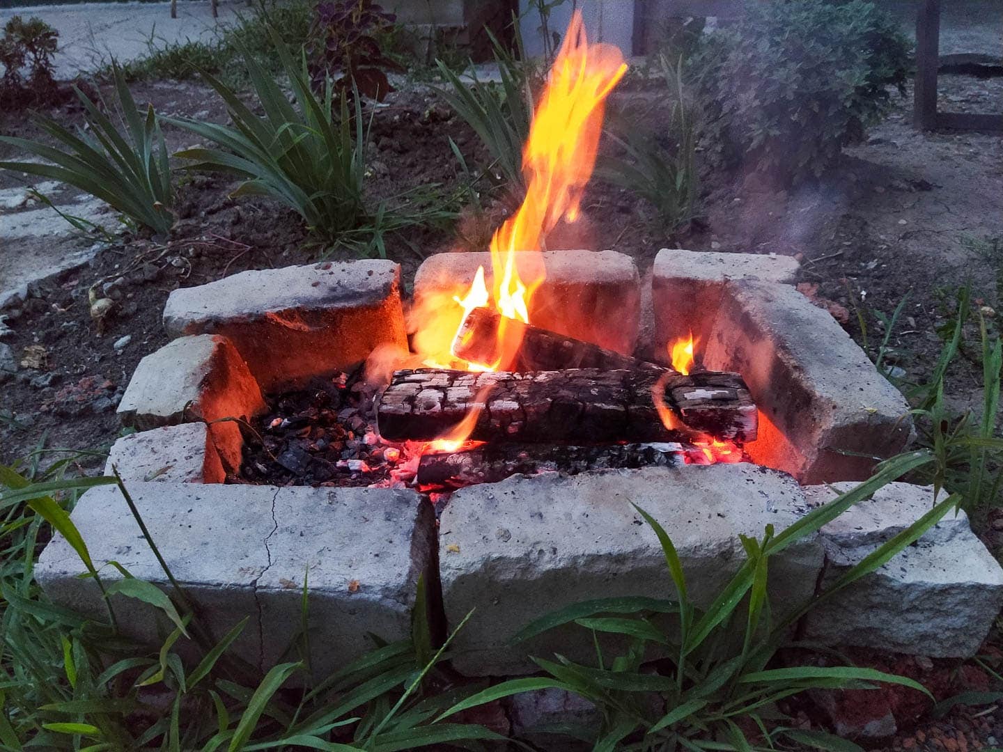 Square fire pit made from large rectangular rocks