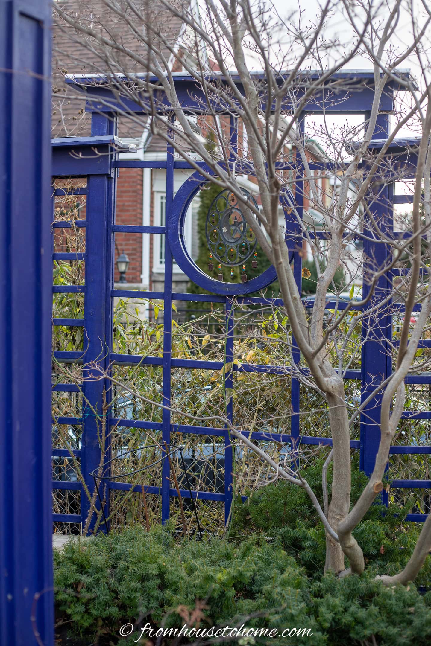 A DIY garden trellis painted blue