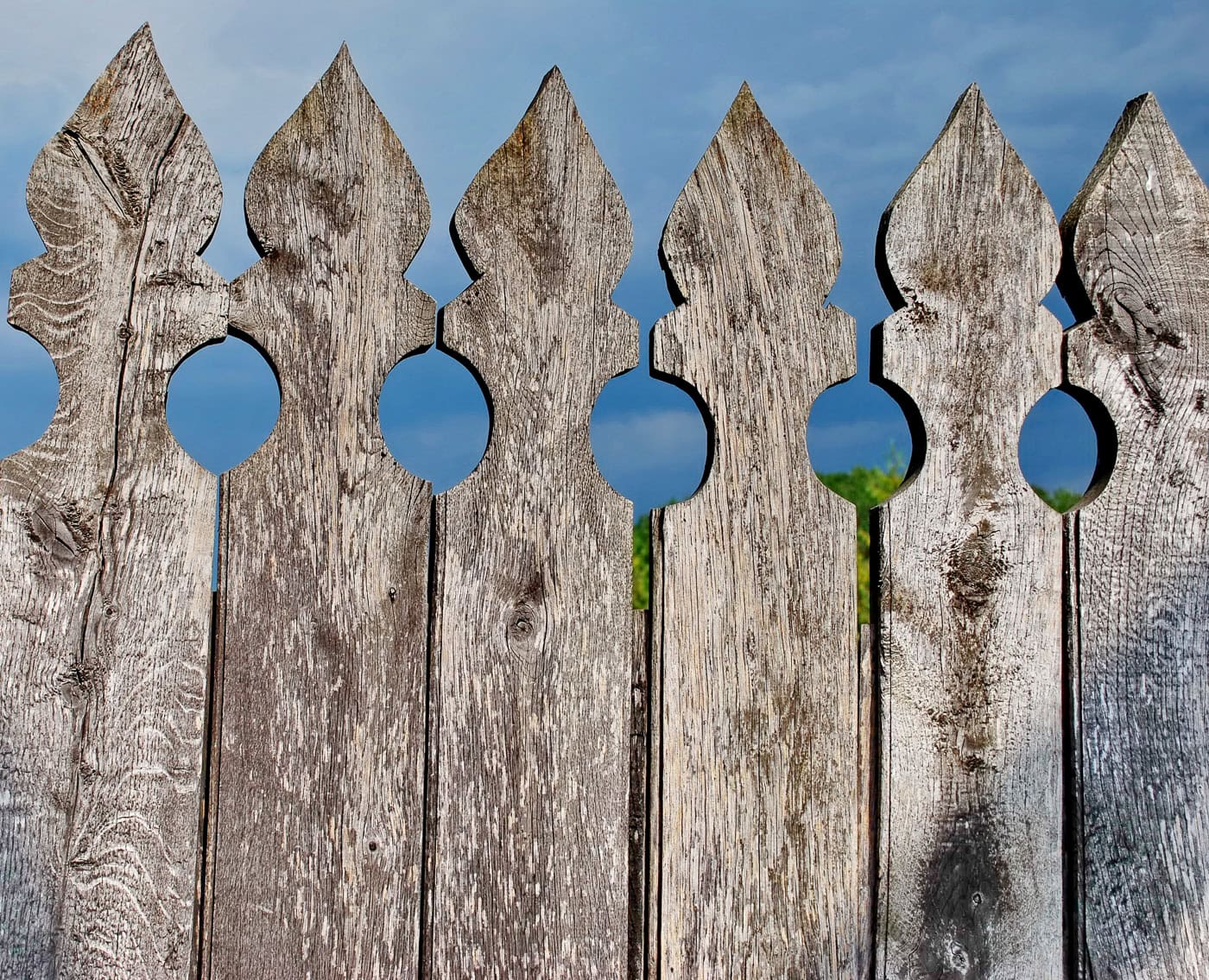 close up of decorative pickets at the top of a fence