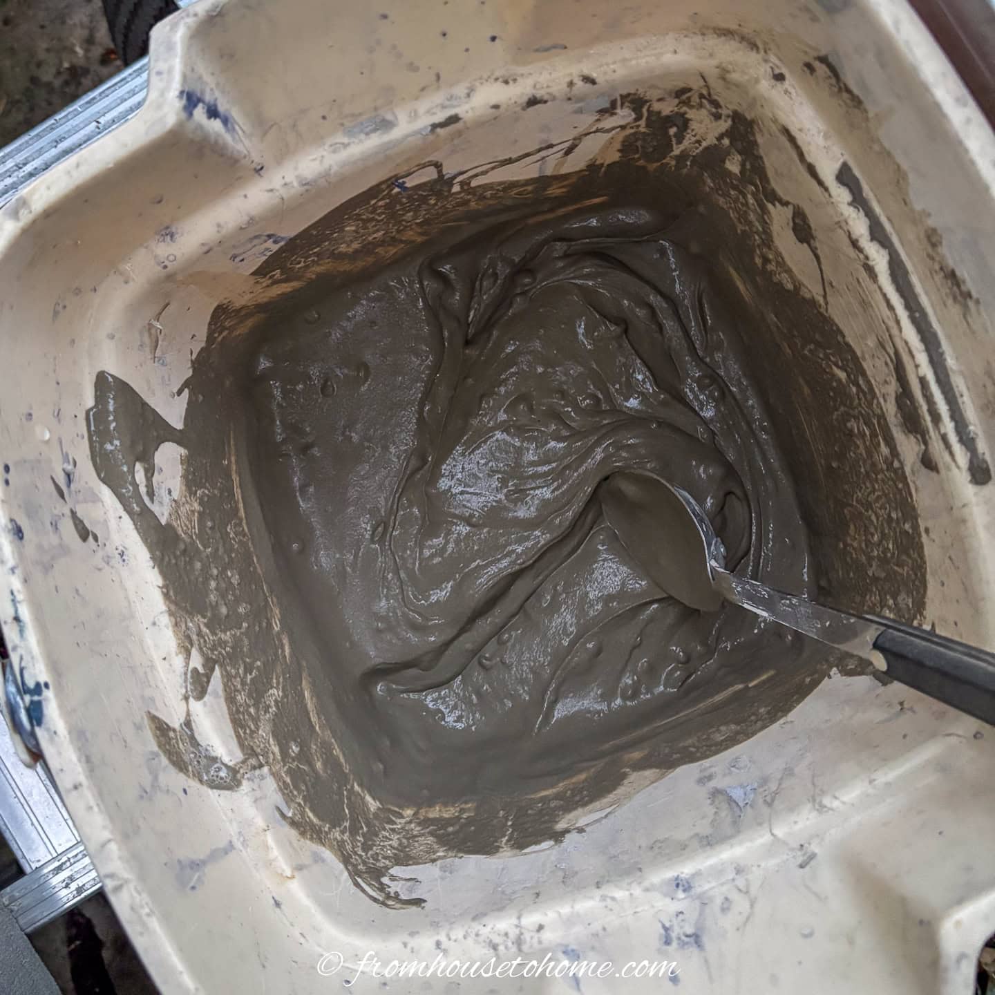 mortar being mixed in a pail