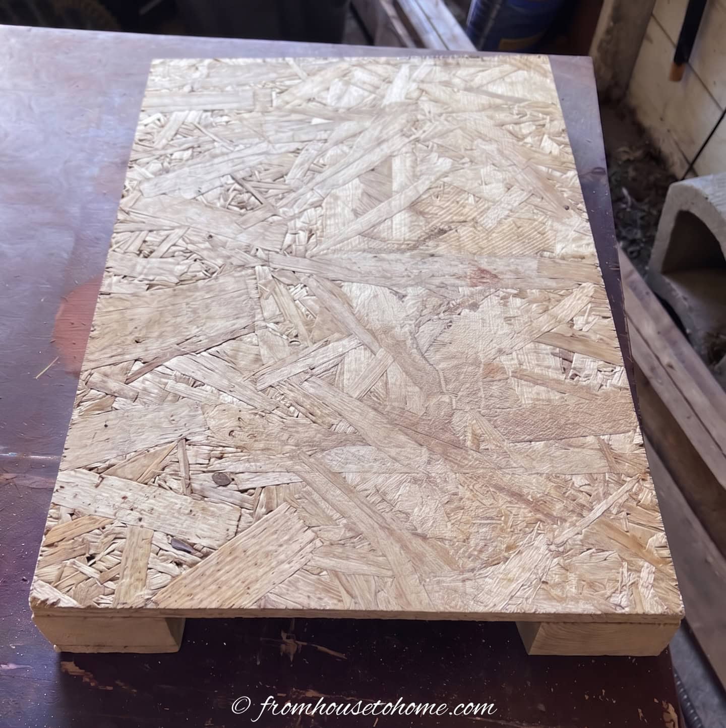 A piece of outdoor plywood with 2" x 4" boards under it