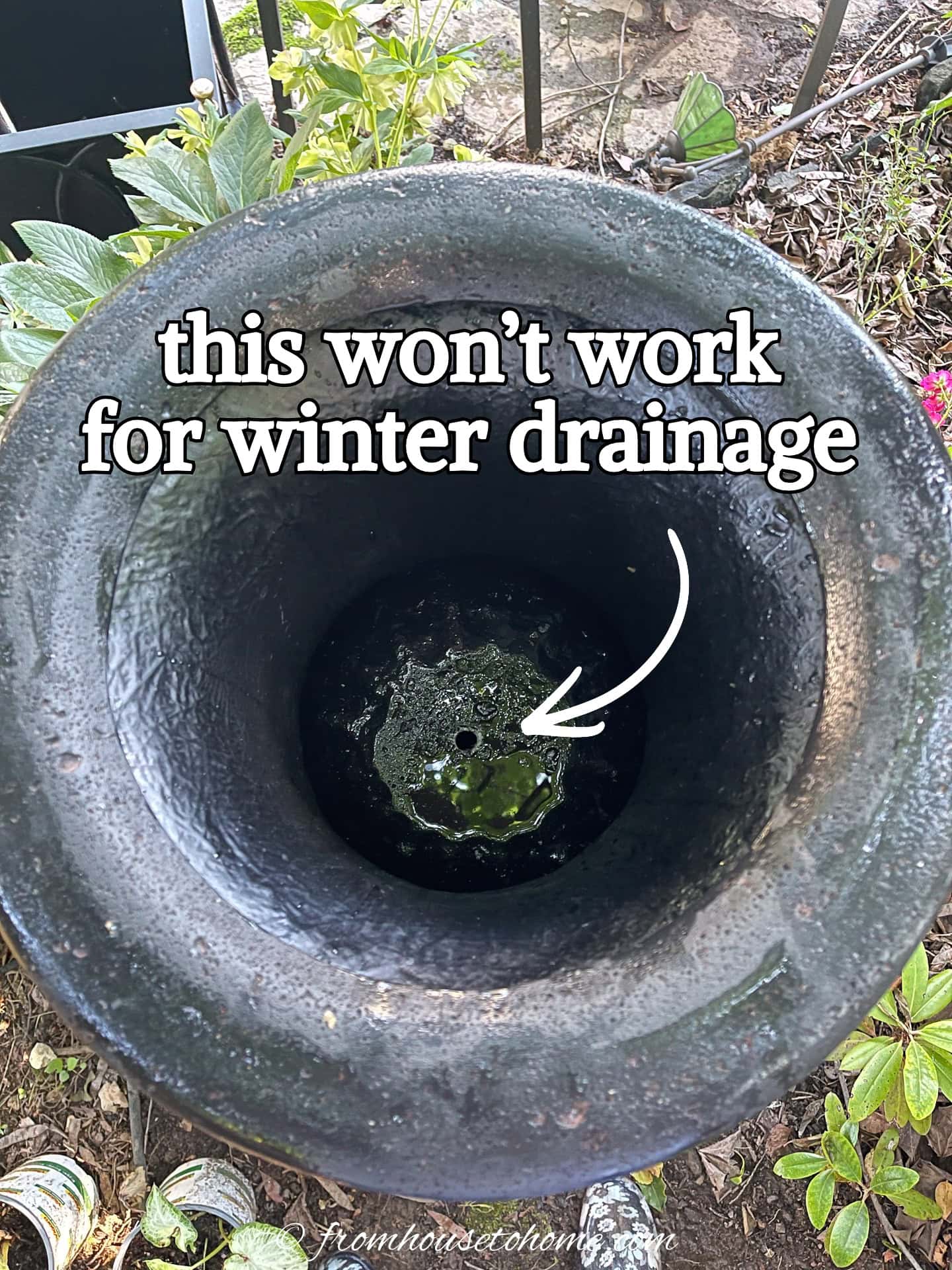 An overhead view of the inside of an urn with a very small drainage hole