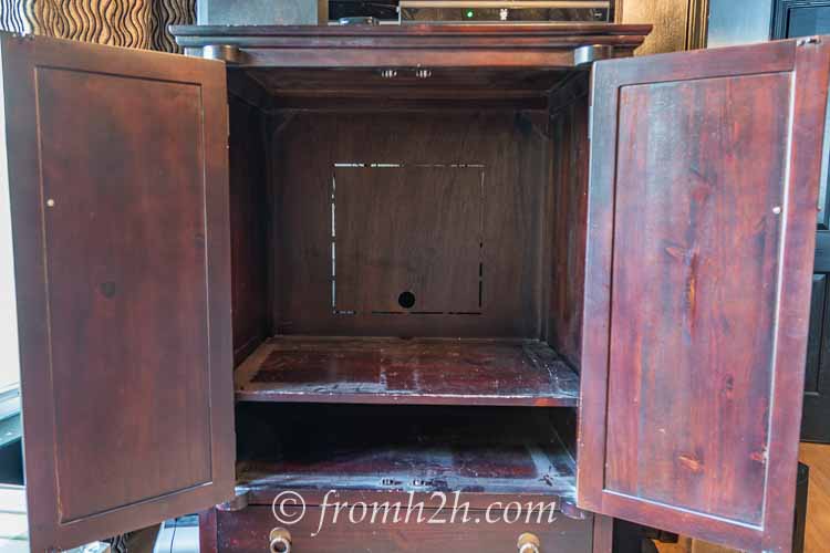 The inside of an empty armoire
