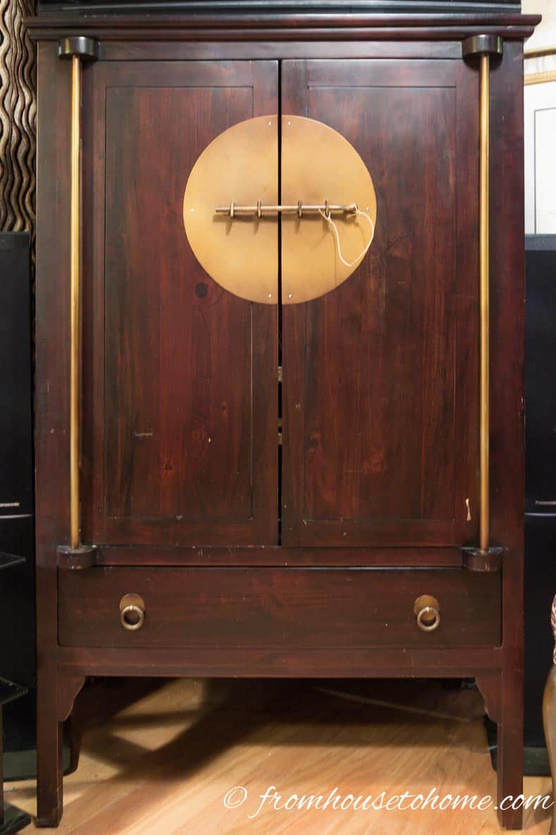 Mahogany TV armoire with brass accents