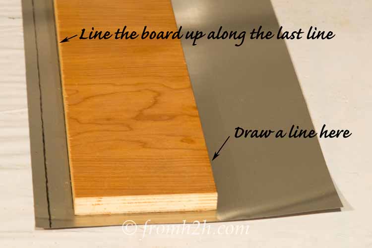 Draw a third line the width of the board over from the second line
