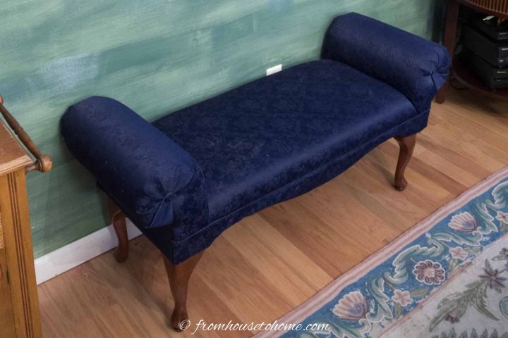 Bench covered in a solid navy blue fabric