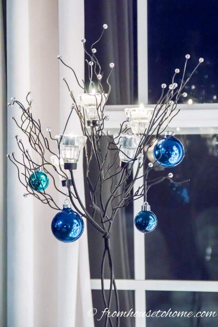 A candle tree with Christmas Ornaments