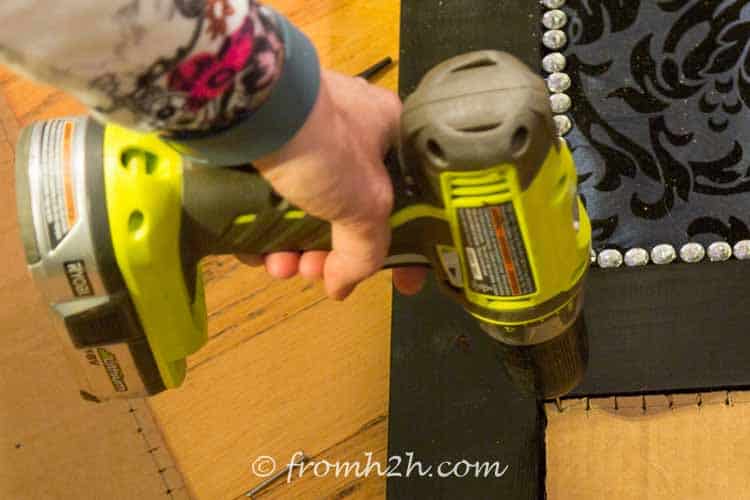 Drill pilot holes where the lines cross | How To Install Nail Head Trim In a Straight Line With Even Spacing