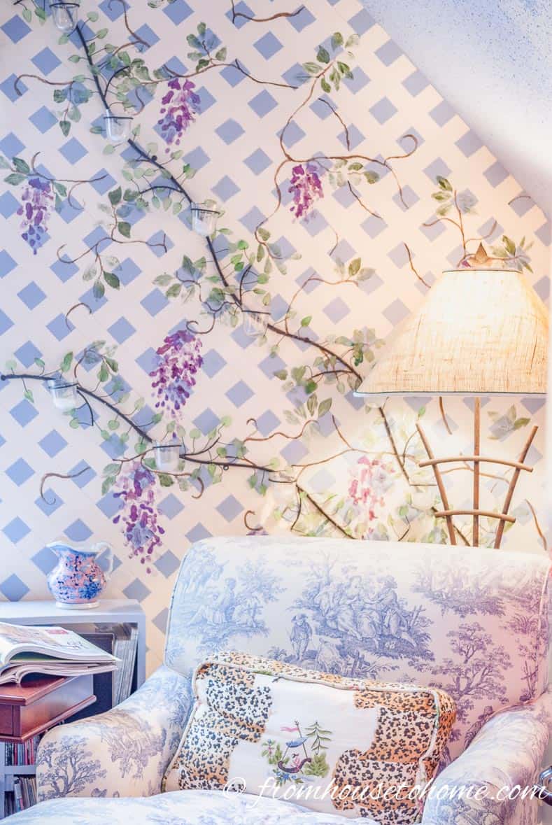 Wall painted like a trellis with wisteria on it