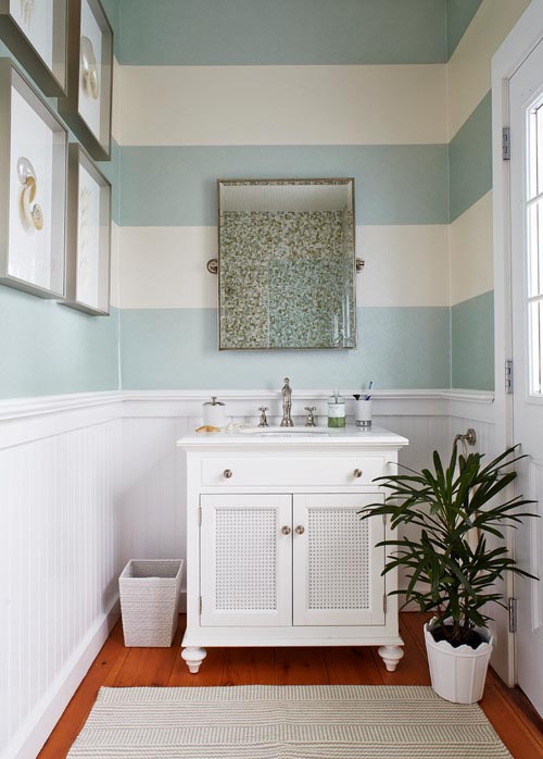 Bathroom painted with turquoise and white horizontal stripes