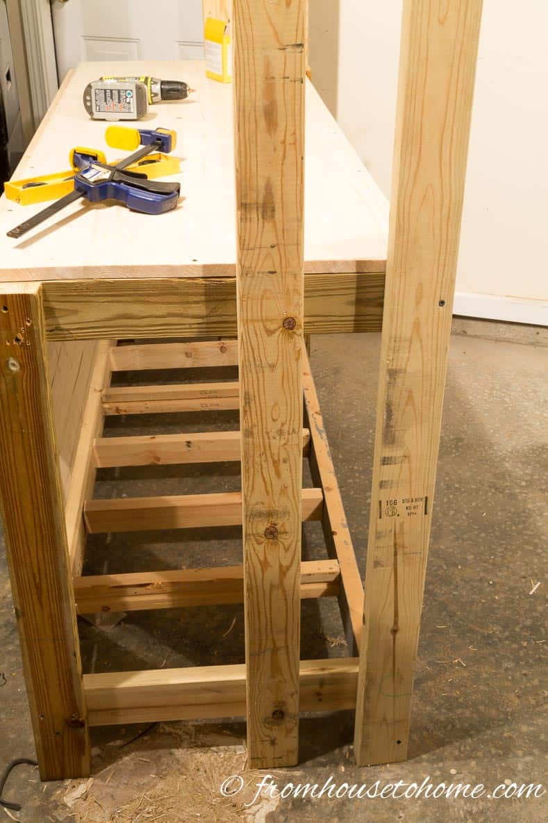 Position the top shelf so that it lines up with the back of the workbench | How To Build a Fold Down Workbench in a Day