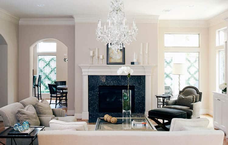 Replace light fixtures...a chandelier will always look more expensive than a builder-grade fan - Traditional Living Room by Houston Interior Designers & Decorators Debra Villeneuve Interiors| 10 Easy Ways To Make Your House Look More Expensive