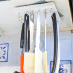 DIY under cabinet storage rack with hanging kitchen utensils