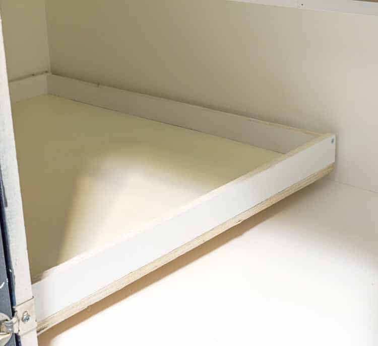 Slide shelf into the drawer slides | How To Build Blind Corner Cabinet Pull Out Shelves