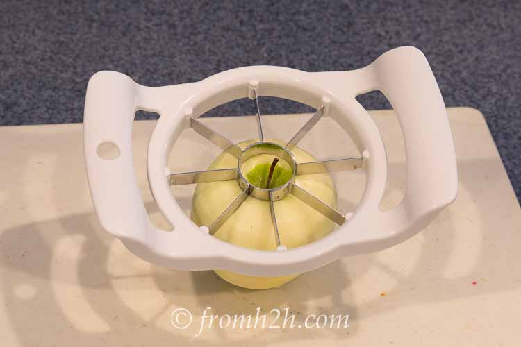 Position the corer around the center of the apple | Inexpensive Kitchen Gadgets That Make Cooking Easier