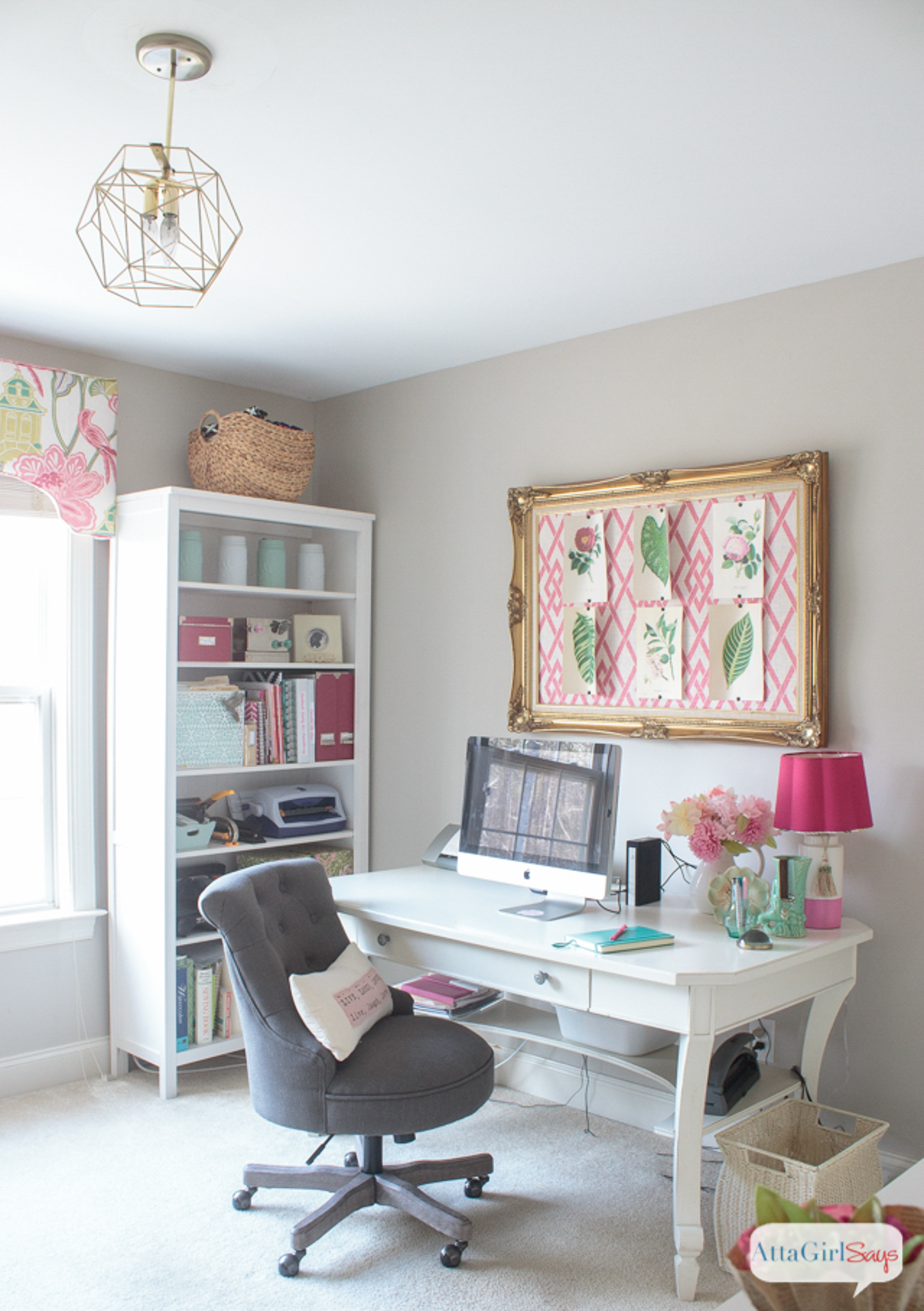 Feminine home office with greige walls and bright pink accents