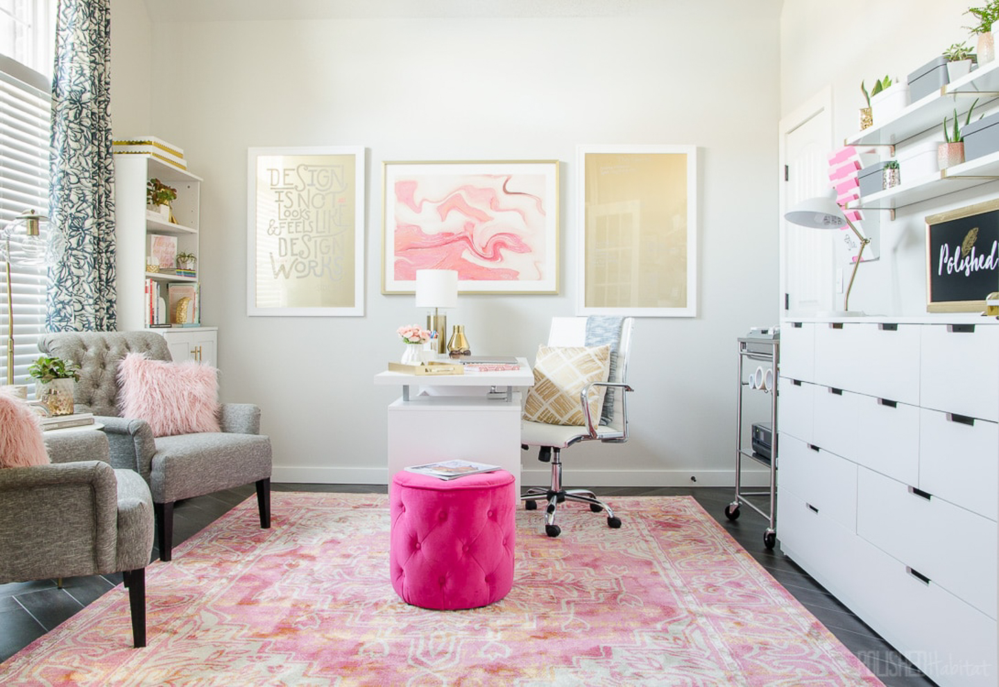 Feminine pink and grey home office with a bright pink ottoman beside the desk