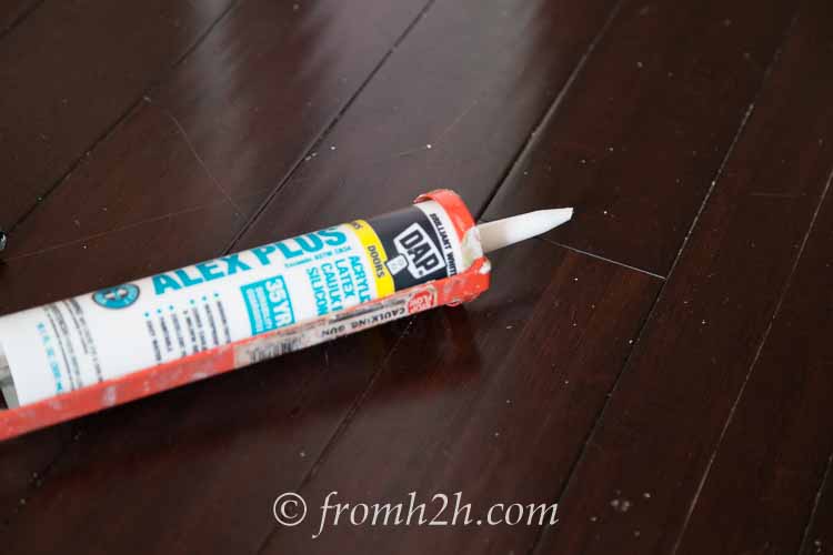 Cut the tube of caulk close to the end | How To Create Built Ins From Mismatched Furniture