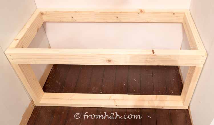 Install the front of the bench frame flush the top frame | DIY Bonus Room Bookshelves And Window Bench