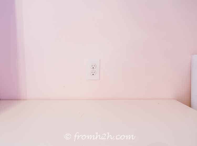 Move electrical outlets to above the cabinet | DIY Bonus Room Bookshelves And Window Bench